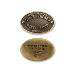 Two brass plaques: top shows 'Société Anonyme Sulzer Frères Winterthur Suisse'; bottom reads 'Machine à vapeur Rhône III 1927 37'